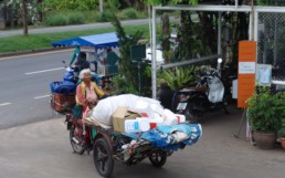 Woman recycling for cash.