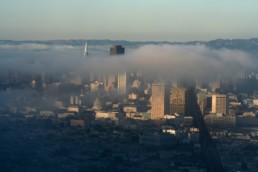 Aerial view of downtown San Francisco with fog coming in from the mountain side.