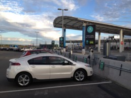 Electric vehicle parked in a charging station.