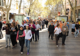 Men and women walking in Barcelona.