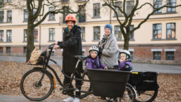 Norwegian family on bikes and carts.