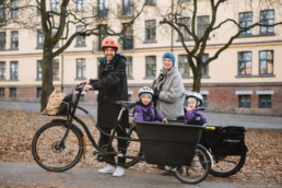 Norwegian family on bikes and carts.