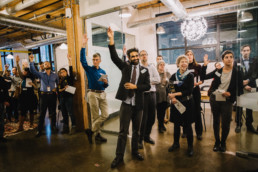 Men celebrating at work.