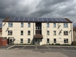 Building with solar panels on the roof in Cardiff.