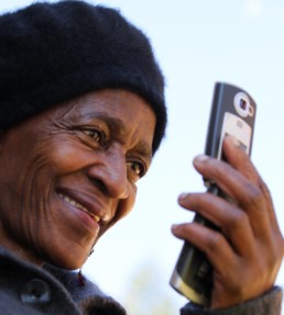 Man using his smartphone and blockchain technology.