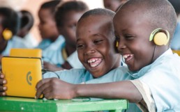 Children playing with a tablet computer, The Kio Kit is a digital education toolbox.