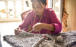 Woman weaving textile. Tonlé