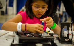 Child fixing an electronic device.