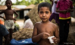 Child eating fortified yoghurt to combat malnutrition.