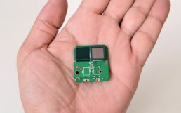 Man holding a microchip