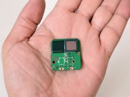 Man holding a microchip