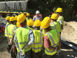 Construction workers having a meeting made to create a holistic corporate supply chain.