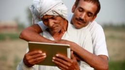 Men using a tablet for the people of the world. Mobile technologies