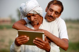 Men using a tablet for the people of the world. Mobile technologies