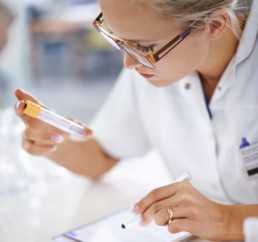 Woman in a laboratory testing samples.