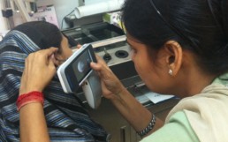 Nurse using an ear device.