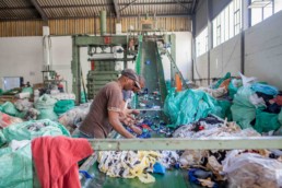 Man sorting waste in Cape Town for the Western Cape Industrial Symbiosis Programme.