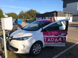 Woman in a TADAA! electric vehicle in Aarhus Municipality.