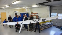 Kitemill staff holding a wind turbine.