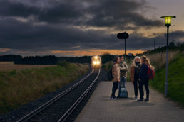 Men and women waiting for the train in Denmark.