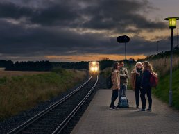 Men and women waiting for the train in Denmark.