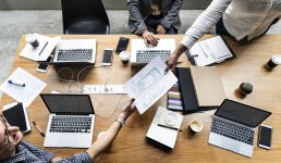 Men and women working in an office.