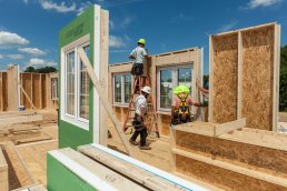 Men building homes