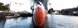 Container ship with two men on it