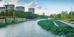 River with waterside deck and greening bank in Ningbo city
